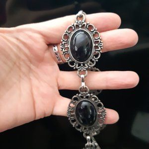 Womens belt. With black Jeweled Emblems.